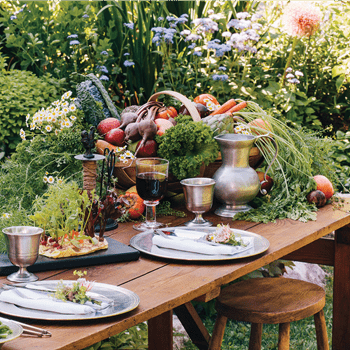 Dianne O'Connor, founder and owner of Weston Table, creates antique decors and tablescapes like this outdoor space.