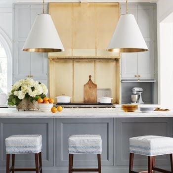 A winning kitchen from celebrated designer Matthew Quinn melds classic style with innovative composition