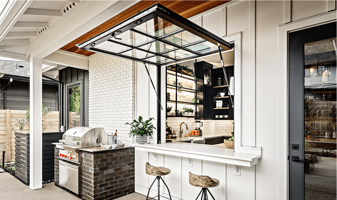 This juice bar joins the spaces. It features a Sub-Zero refrigerator, an undercounter refrigerator, and a Cove dishwasher.