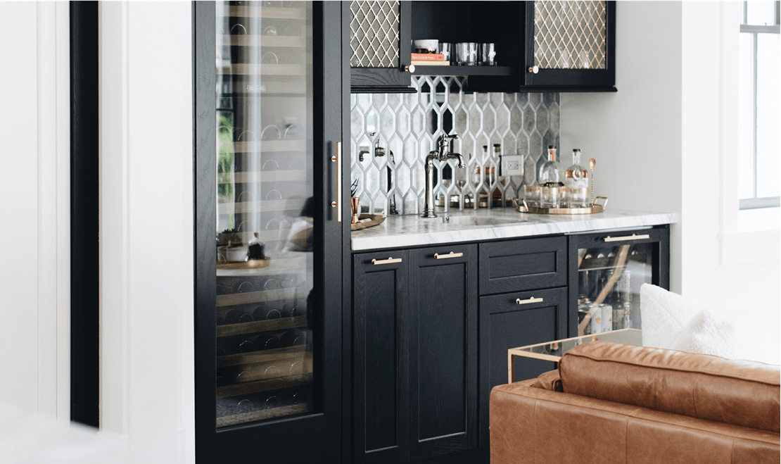 The bar and lounge area, or the "hearth room", features a Sub-Zero Beverage Refrigerator and a Sub-Zero Wine Storage unit.