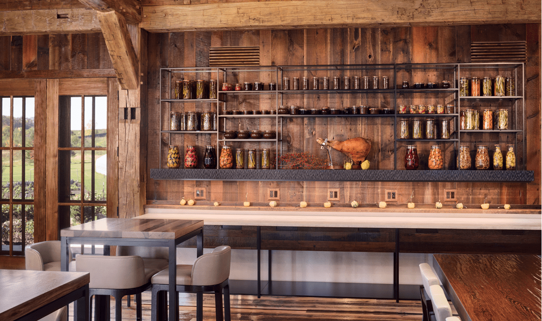 The barn's dining spaces, and farm-to-table aesthetic are accentuated by the reclaimed wood used.