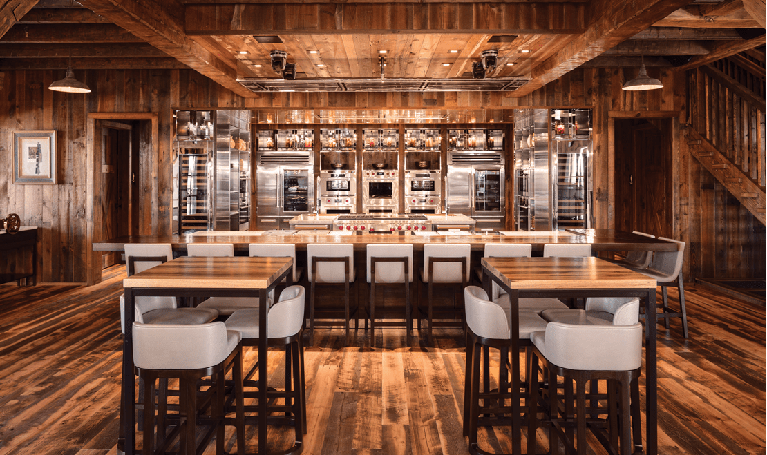 Reclaimed wood lines the barn's interior along with Sub-Zero, Wolf, and Cove products.