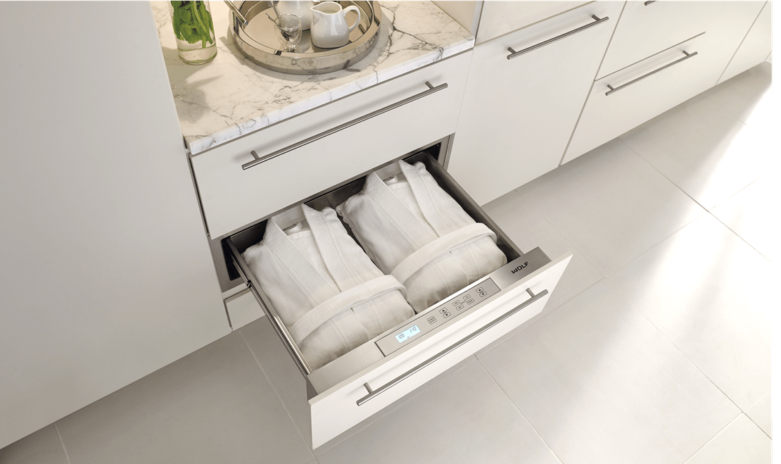 Even spas can tastefully have Sub-Zero, Wolf, and Cove appliances, like this spa featuring a 30-inch Wolf Warming Drawer.