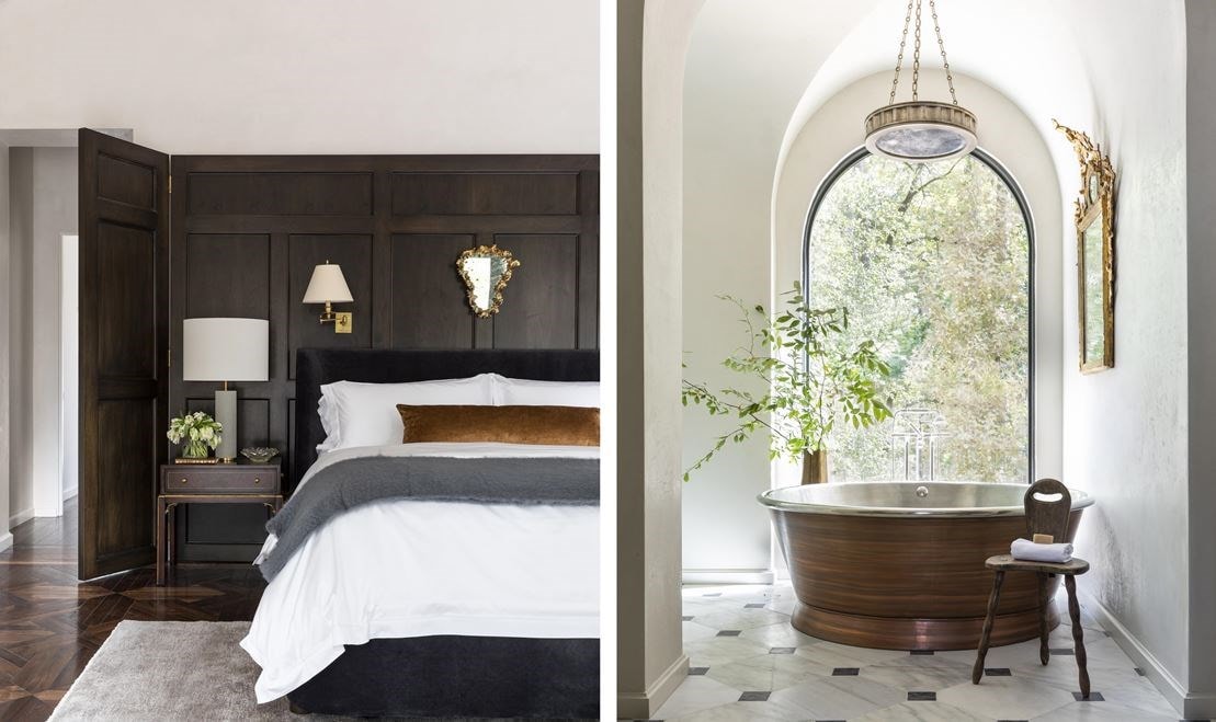 Majestic copper soaking tub set before an arched window that projects in the landscape.