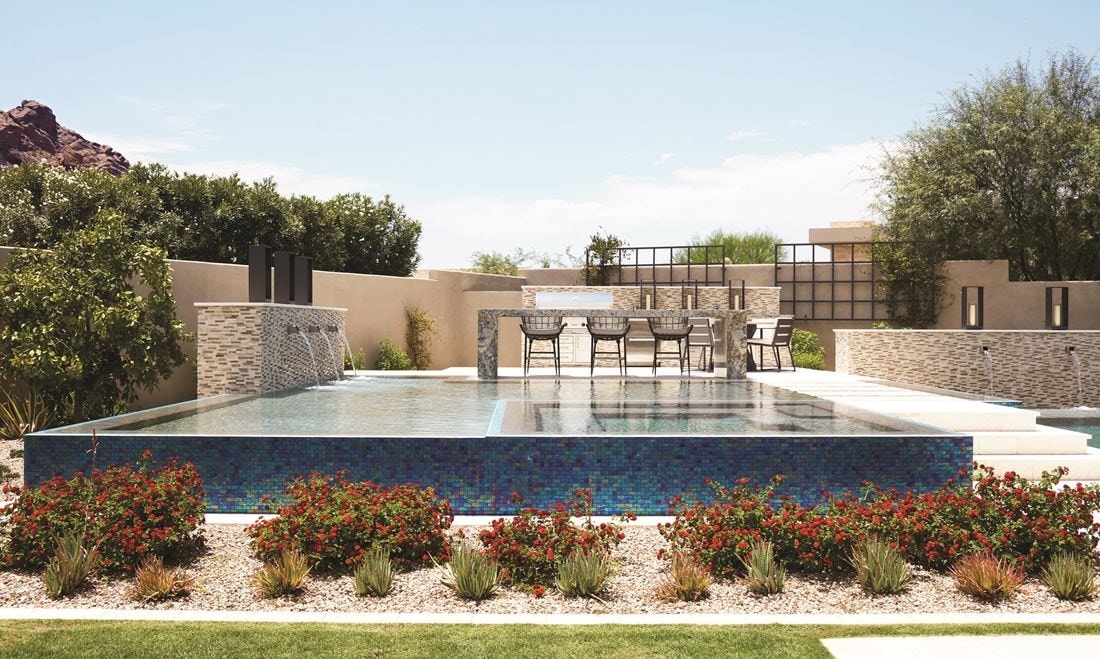 Terracotta tones continue on the outdoor patio and pool area, reflecting the glorious desert landscape