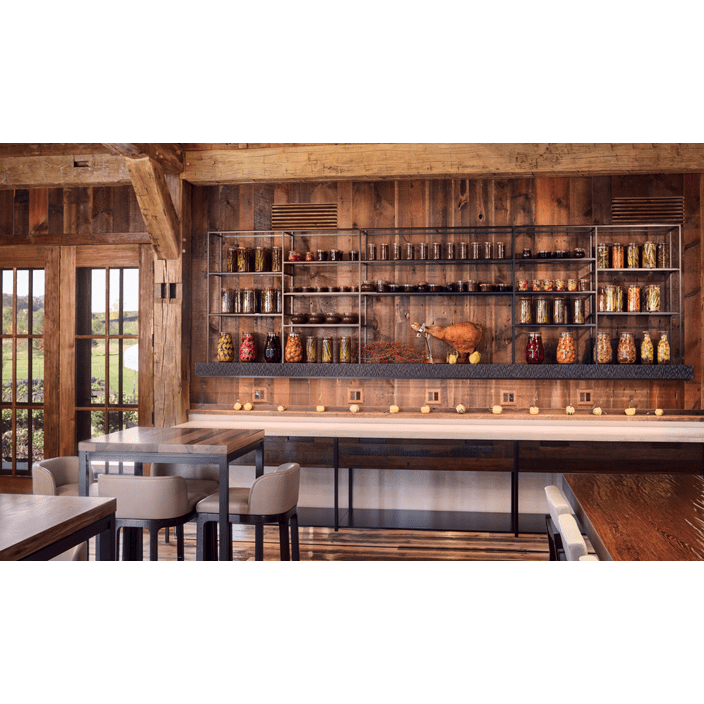 The barn's dining spaces, and farm-to-table aesthetic are accentuated by the reclaimed wood used.