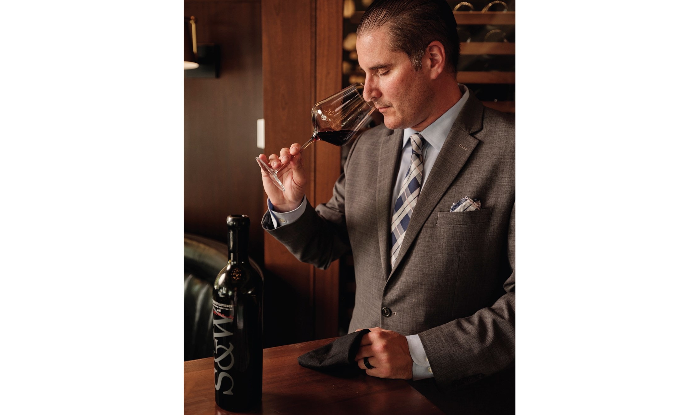 National Beverage Director Christian Gianaris samples a fine vintage at the Smith & Wollensky in Wellesley, Massachusetts/Dan Cutrona