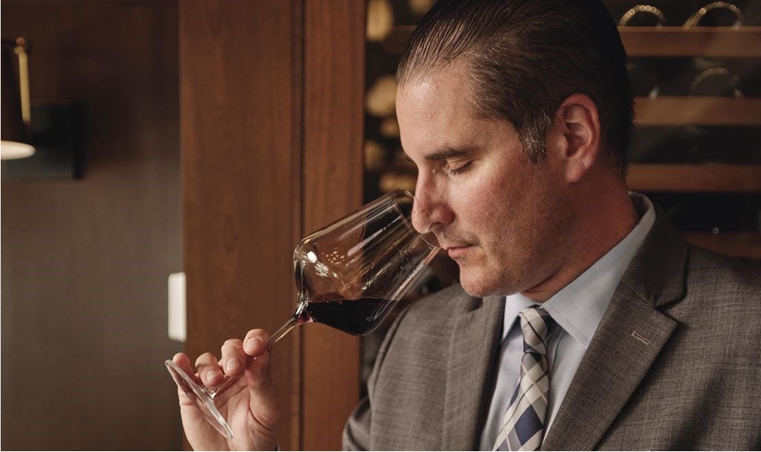 National Beverage Director Christian Gianaris samples a fine vintage at the Smith & Wollensky in Wellesley, Massachusetts/Dan Cutrona