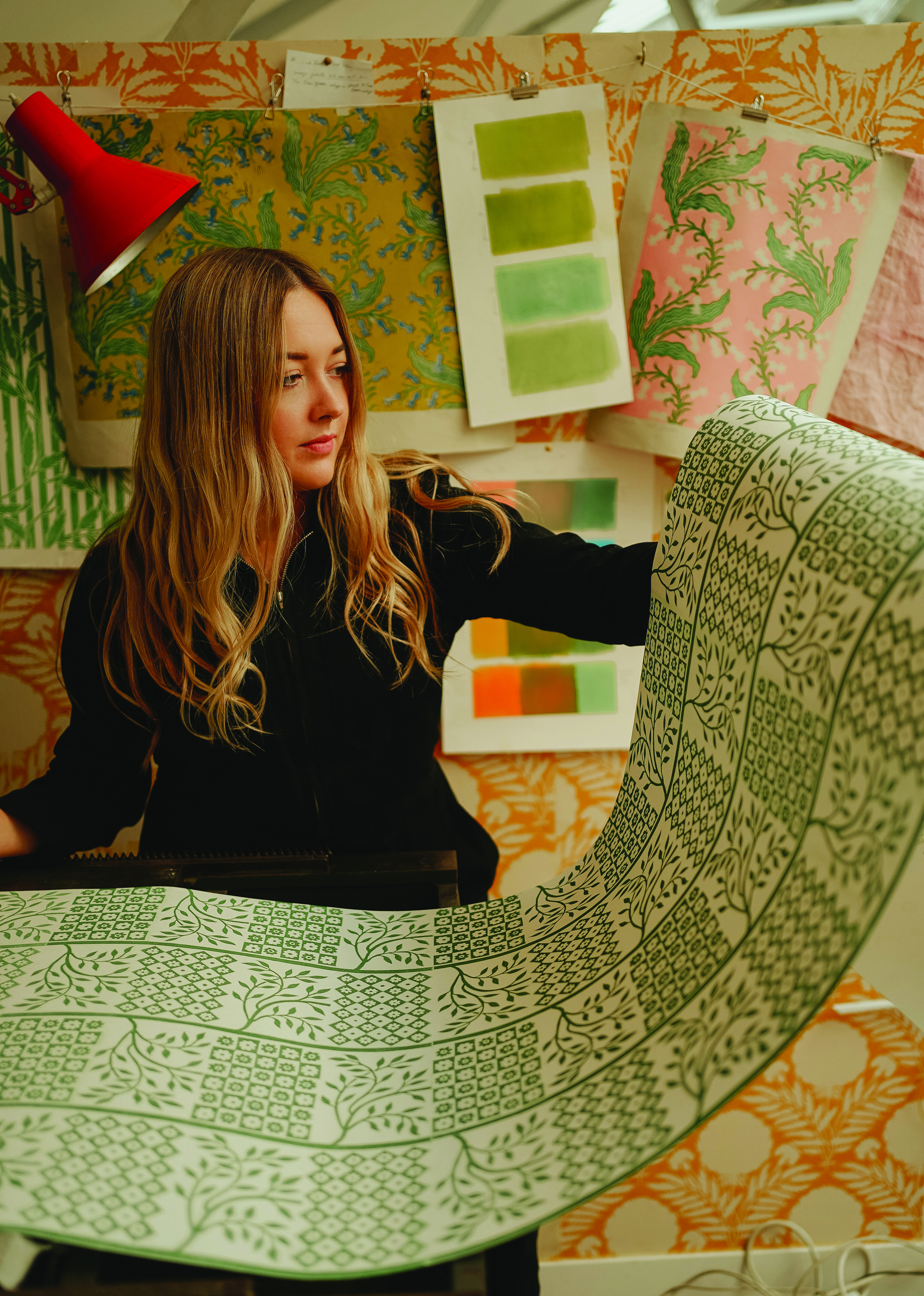 Merchant hand-inks her patterns for her fabrics and wallpapers