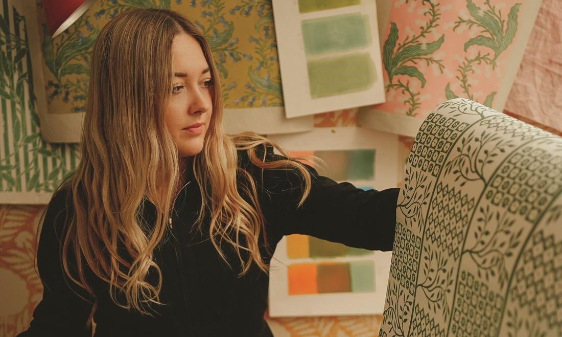 Merchant hand-inks her patterns for her fabrics and wallpapers