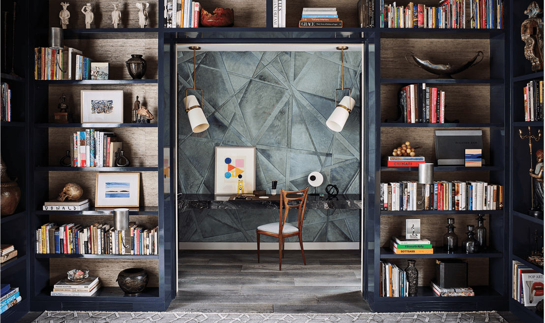 A custom interior collaboration with Jeffers Design Group highlighting an exceptional workspace hidden within shelves.