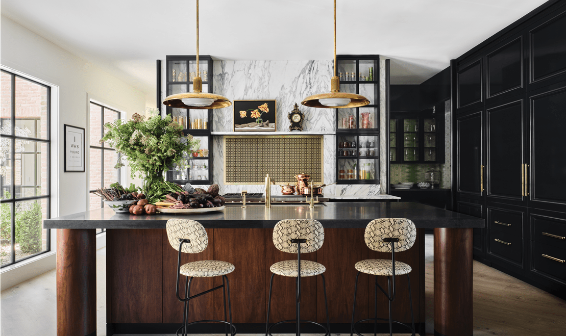 The kitchen features a marble wall above a Wolf 60-inch Pro-Style Dual Fuel Range with French Top.
