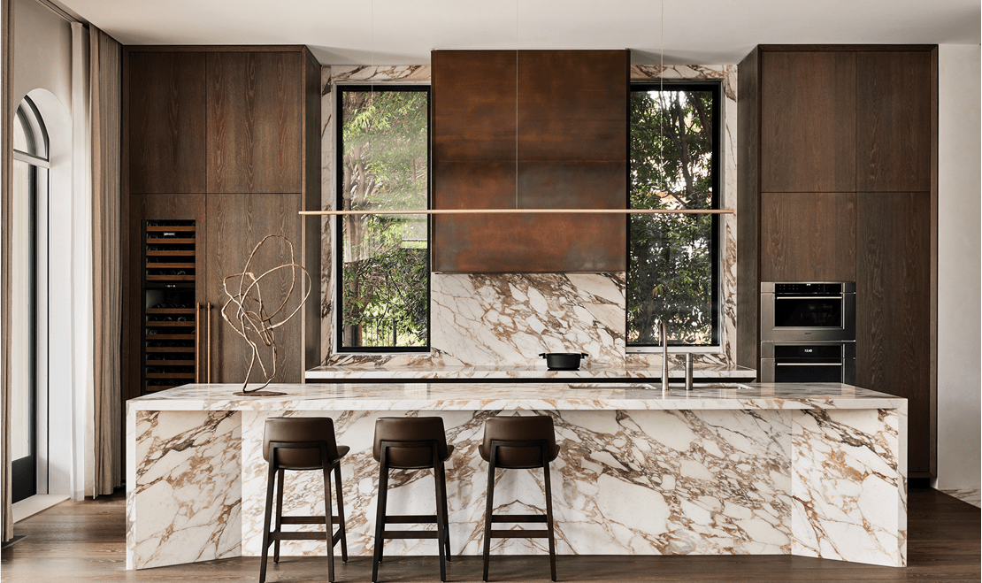A wide shot of Rob Mills' kitchen design that has a very tasteful brown and white color pallette.