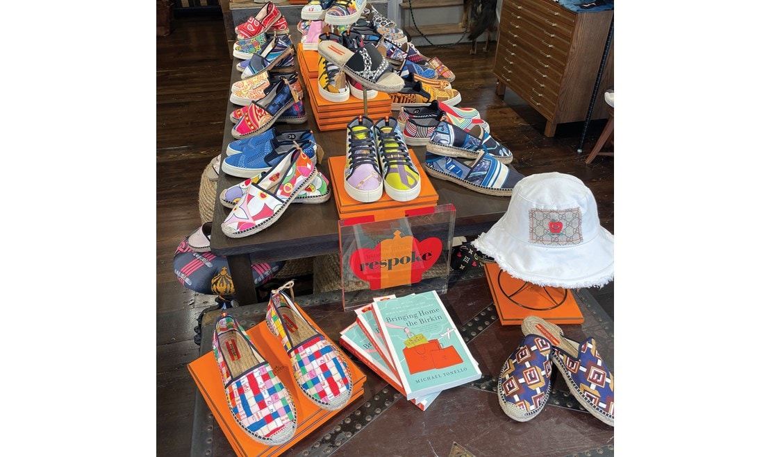 Respoke store interior featuring designer footwear and Michael Tonello's best-seller, "Bringing Home the Birkin."