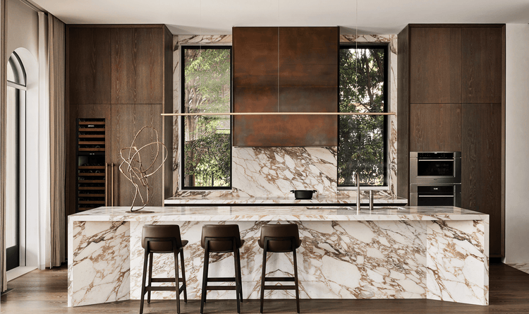 A wide shot of Rob Mills' kitchen design that has a very tasteful brown and white color pallette.