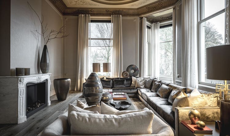 A modern fireplace warms the living space in this Dutch home.