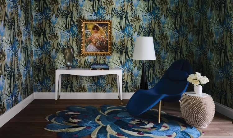A unique blue-and-green space featuring a custom floral rug created by Kyle Bunting for Salicito Design Group.