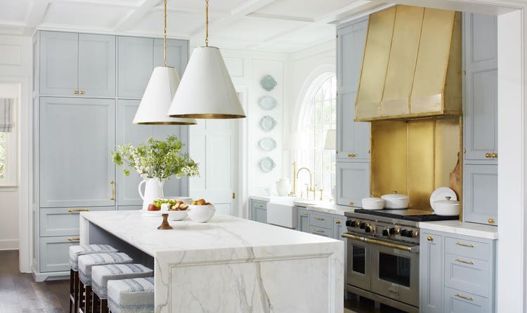 Brass and gold tones are incorporated throughout this Matthew-Quinn designed kitchen in the Buckhead neighborhood of Atlanta.