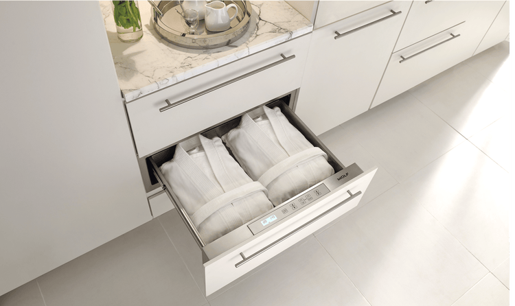 Even spas can tastefully have Sub-Zero, Wolf, and Cove appliances, like this spa featuring a 30-inch Wolf Warming Drawer.