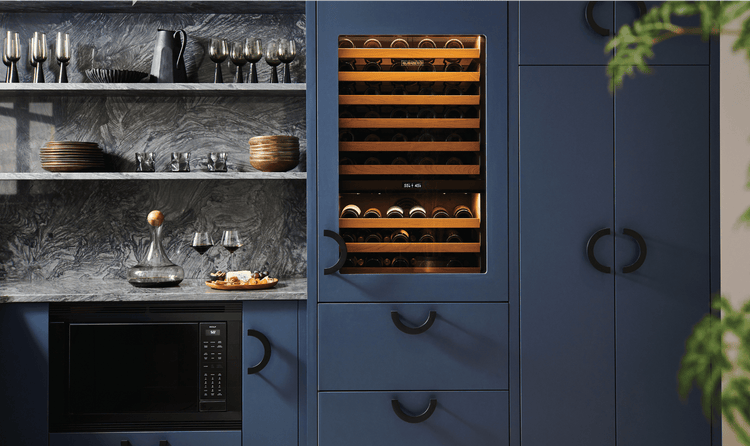 This Wolf Convection Microwave is hidden with black trim, right next to a Built-In Sub-Zero Wine Storage Unit.