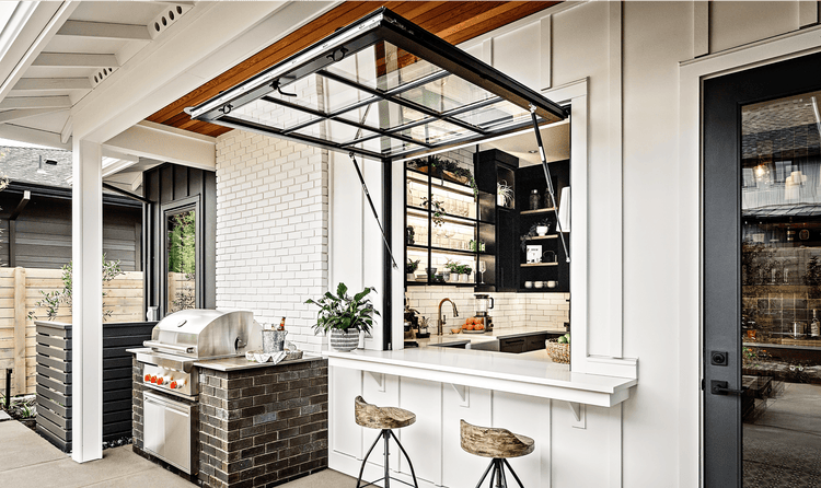 This juice bar joins the spaces. It features a Sub-Zero refrigerator, an undercounter refrigerator, and a Cove dishwasher.