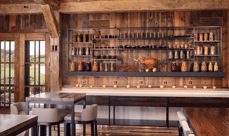 The barn's dining spaces, and farm-to-table aesthetic are accentuated by the reclaimed wood used.