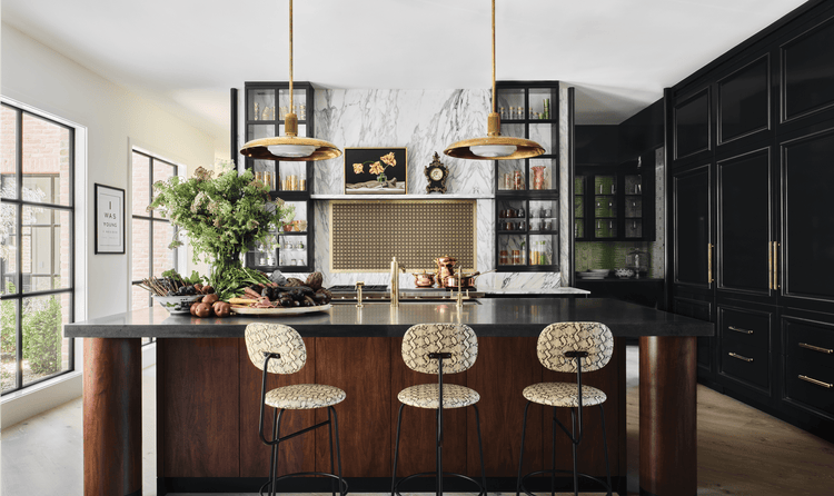 The kitchen features a marble wall above a Wolf 60-inch Pro-Style Dual Fuel Range with French Top.