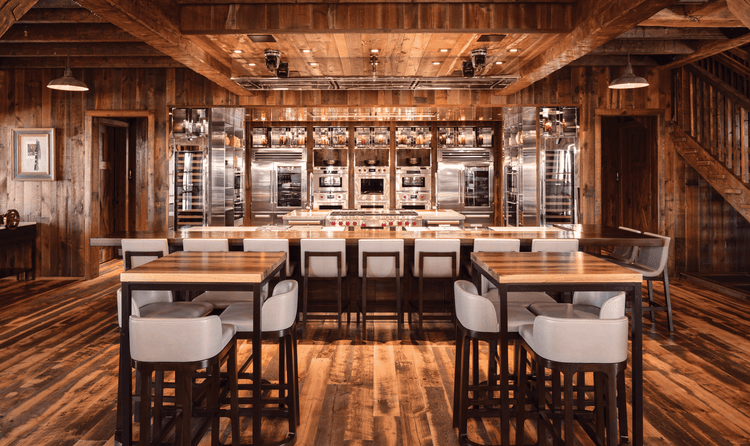 Reclaimed wood lines the barn's interior along with Sub-Zero, Wolf, and Cove products.