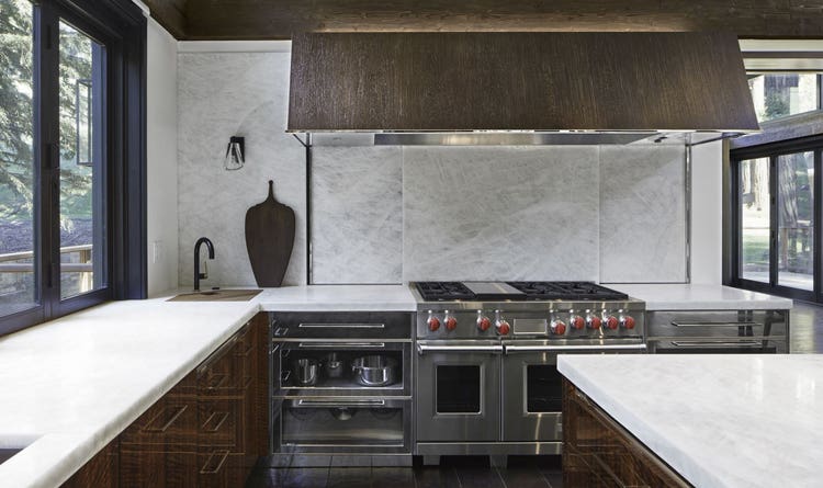 Wolf 6 Burner Gas Range with Griddle featured in a custom kitchen designed by Mick De Giulio in California.