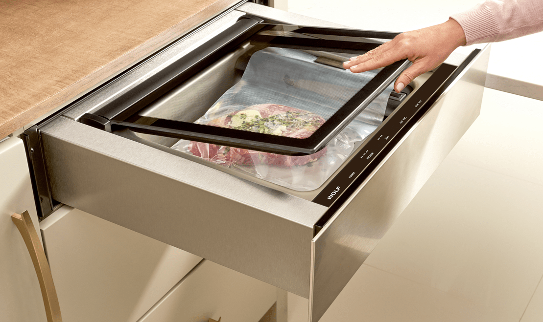 Glazed teriyaki infused rib of beef being prepped to be placed within a Wolf Vacuum Seal Drawer