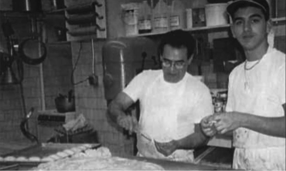 A young Valastro and his father working together at Carlo's Bakery.