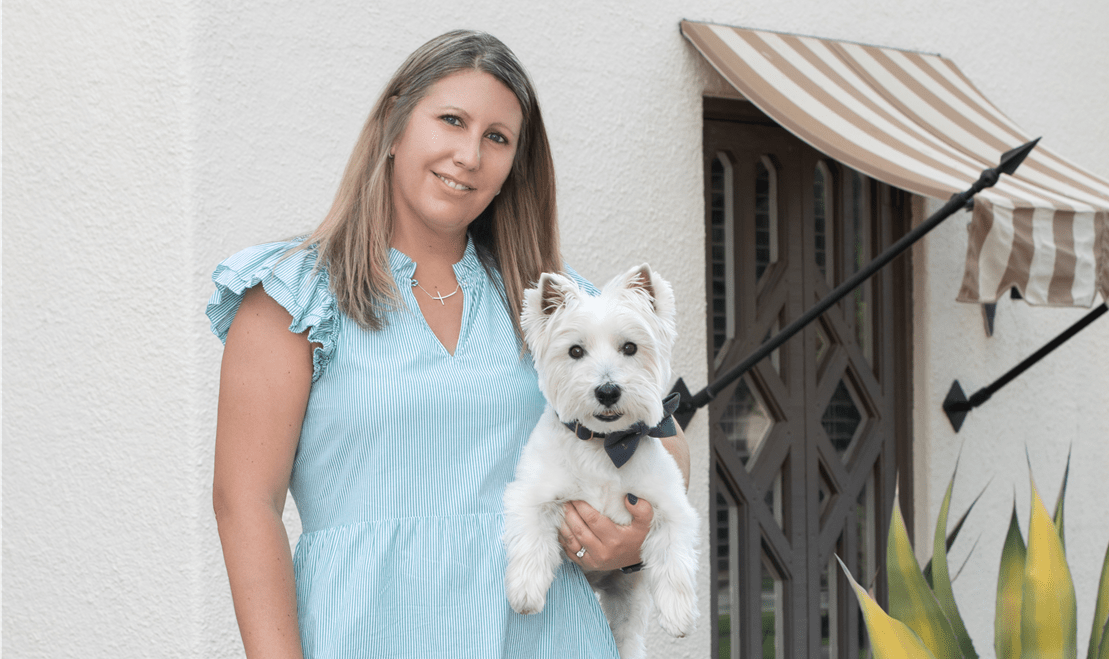 McKenzie, pictured with her Westie, Winston, loves to travel when she has the opportunity and Wisconsin sports.