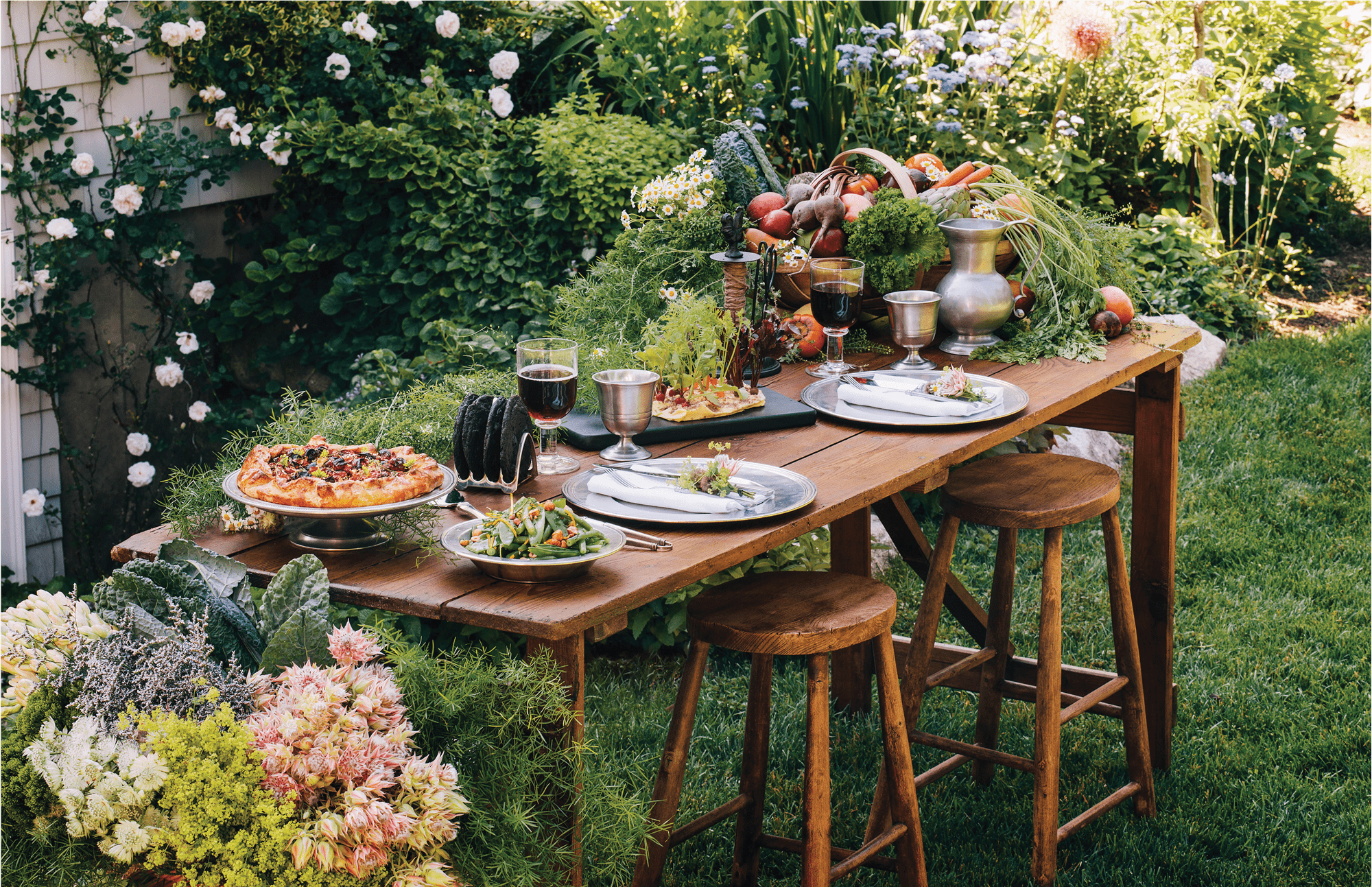 Dianne O'Connor, founder and owner of Weston Table, creates antique decors and tablescapes like this outdoor space.