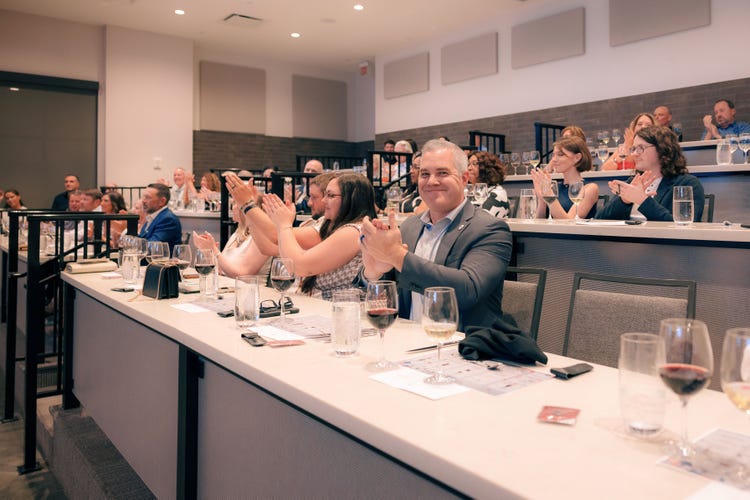 Andrew Workman, Manager of Corporate Development at Hire Heroes USA, seated during the event at Sub-Zero Group Miami's Showroom.
