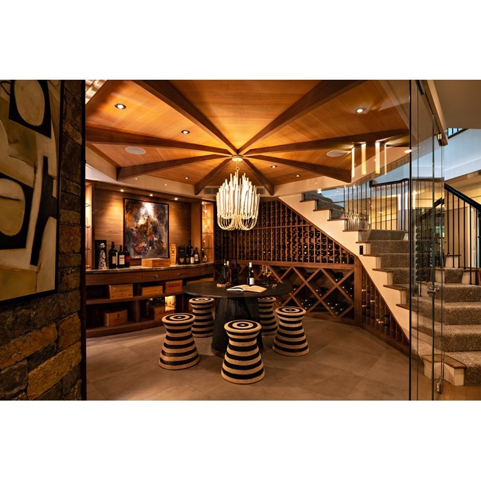 A cavern-like wine cellar for storage and celebration is the centerpiece of a New England home.