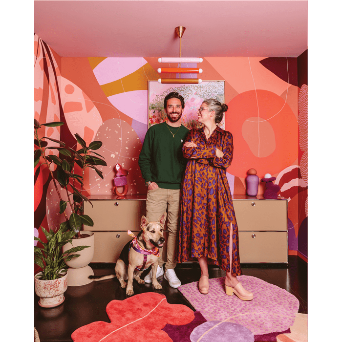 Artist Alex Proba, known for her colorful creations, pictured right, at home with her partner, Ian Coyle, pictured left.