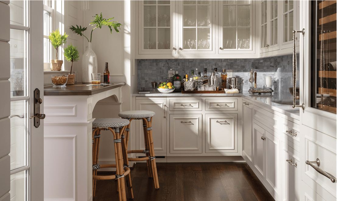 A butler's pantry can be accessed from outside. Inside is a Sub-Zero Wine Storage unit and a Sub-Zero icemaker.