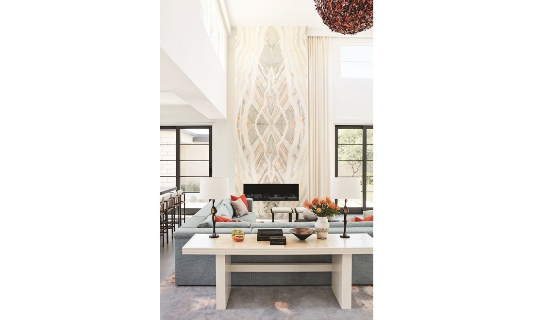 Dramatic stone for the 18-foot fireplace wall in double-height living room is Southern Cross onyx.