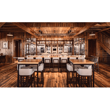 Reclaimed wood lines the barn's interior along with Sub-Zero, Wolf, and Cove products.