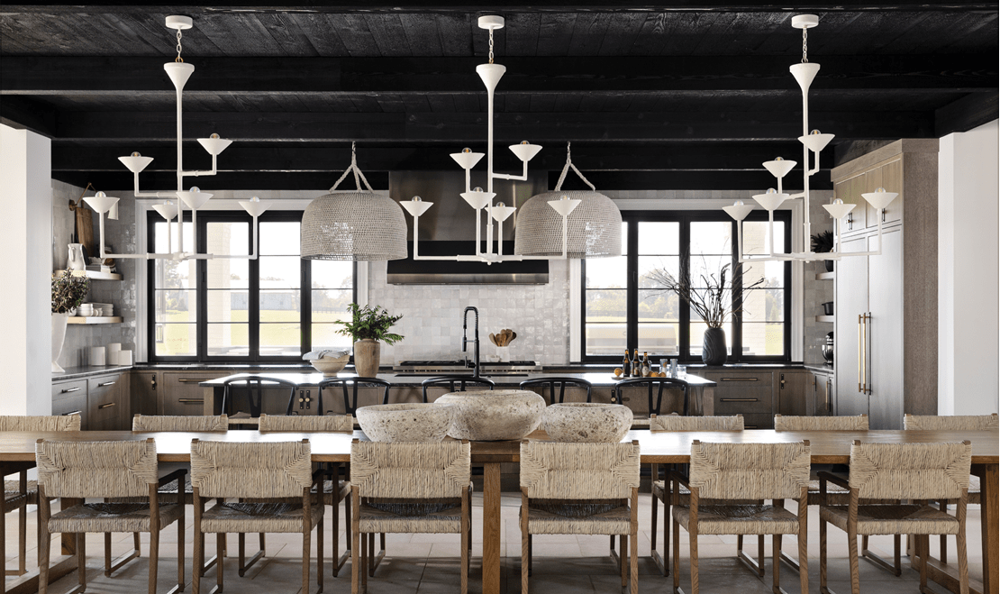 Paranjape's team can plan for simple or extravagant lighting fixtures, like this open-plan kitchen and dining room.