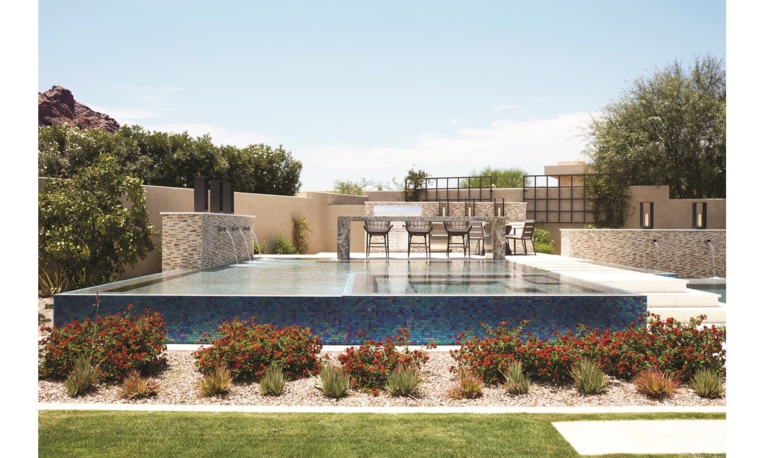 Terracotta tones continue on the outdoor patio and pool area, reflecting the glorious desert landscape