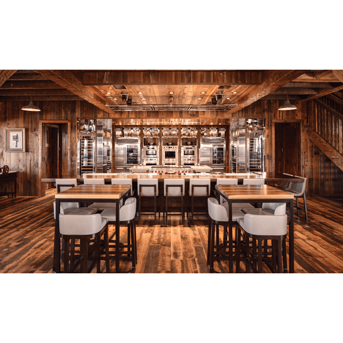 Reclaimed wood lines the barn's interior along with Sub-Zero, Wolf, and Cove products.