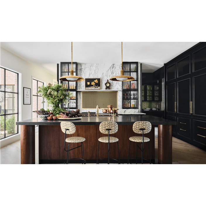 The kitchen features a marble wall above a Wolf 60-inch Pro-Style Dual Fuel Range with French Top.