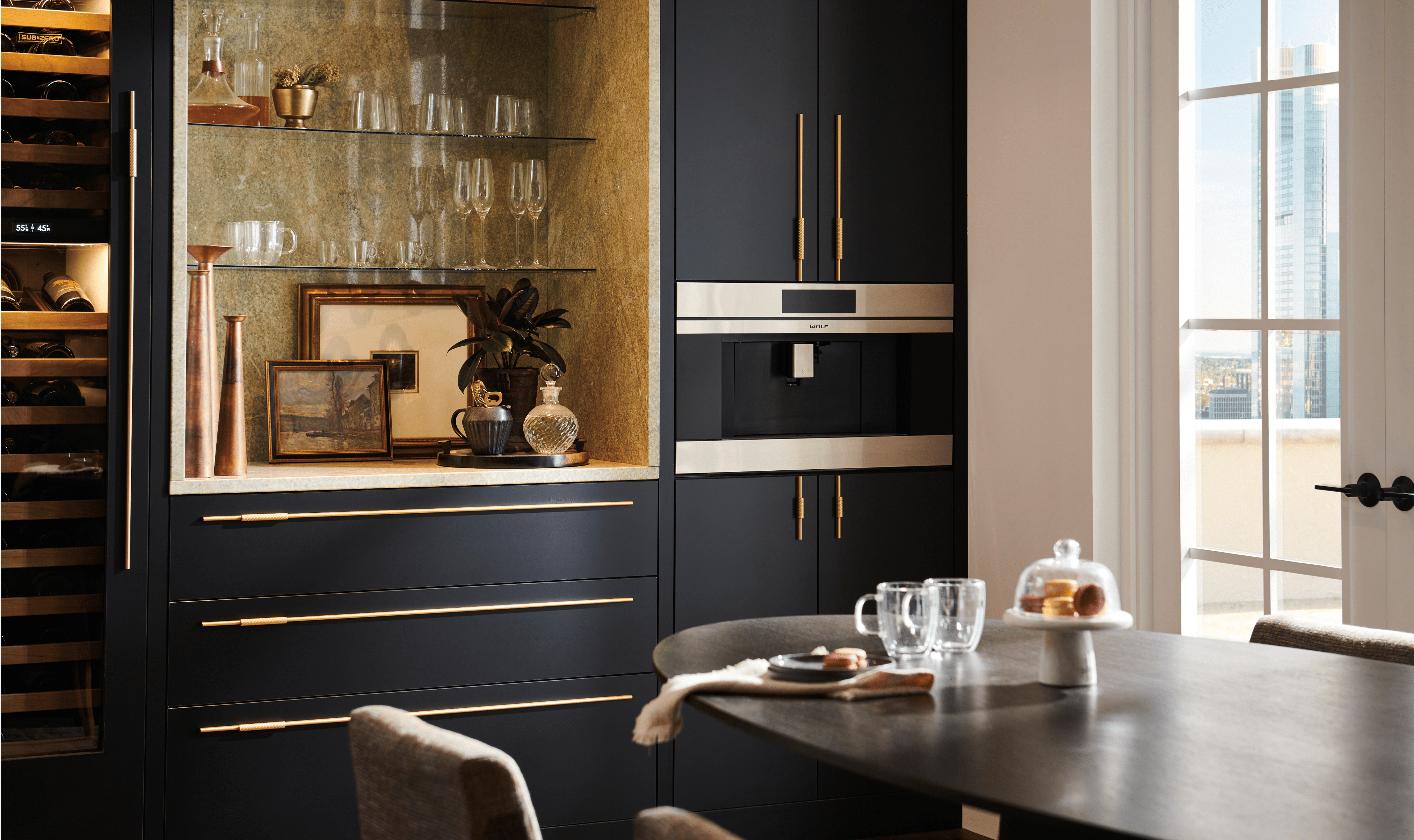 In this penthouse's dining room, a 30-inch M Series Coffee System can be seen next to a Sub-Zero Designer Wine Refrigerator.
