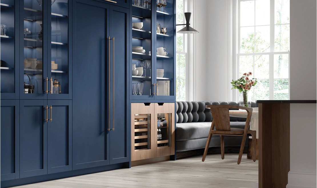 An image of the Breakfast Club room near the kitchen features an ADA-height Sub-Zero Beverage Center and Wine Storage Unit.