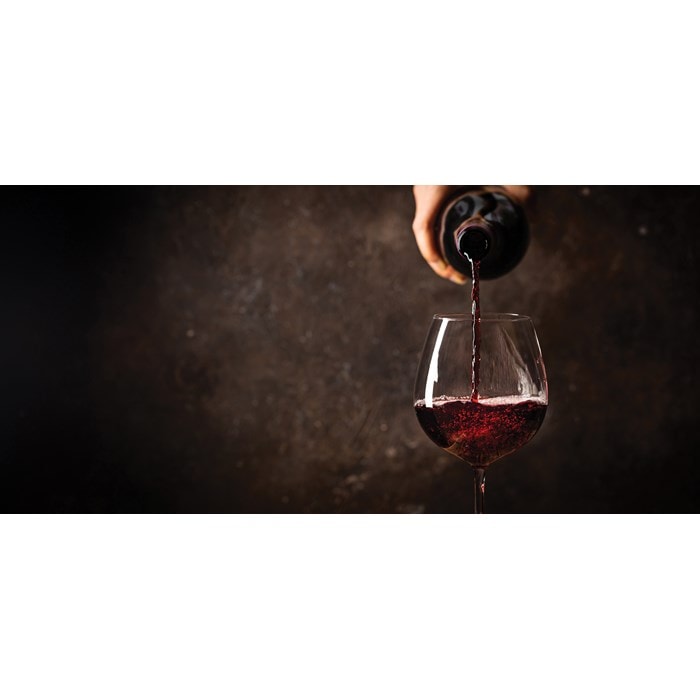 A cavern-like wine cellar for storage and celebration is the centerpiece of a New England home.