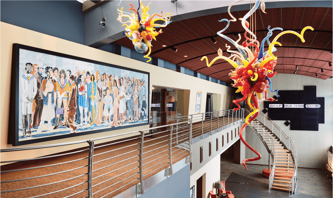 Inside the Westye F. Bakke Center, it features a mural of different famous figures and a creative ceiling fixture.