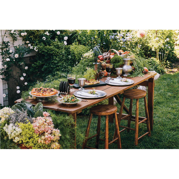 Dianne O'Connor, founder and owner of Weston Table, creates antique decors and tablescapes like this outdoor space.
