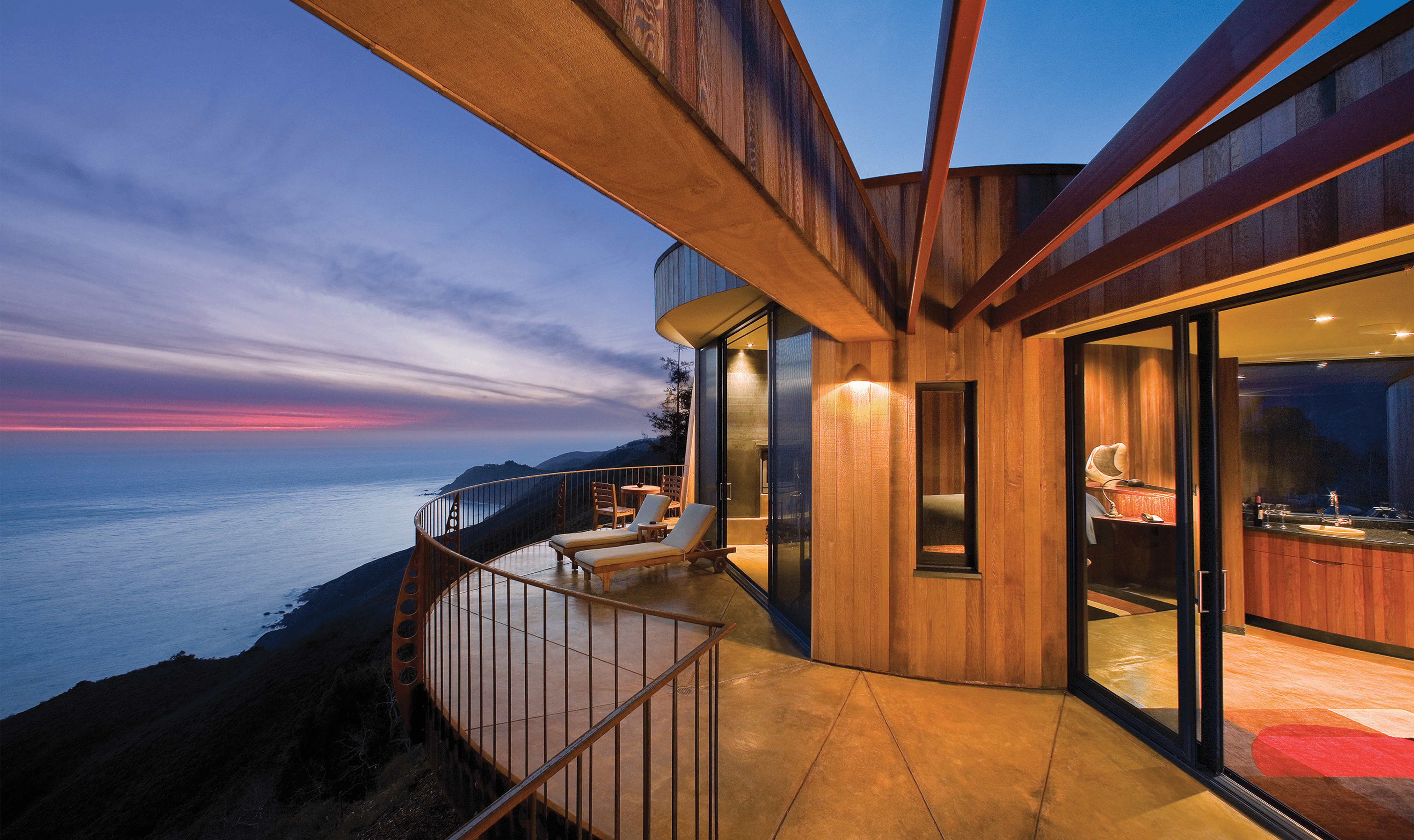 A view of the balcony with the sunset in the background from the Post Ranch Inn in Big Sur, California.