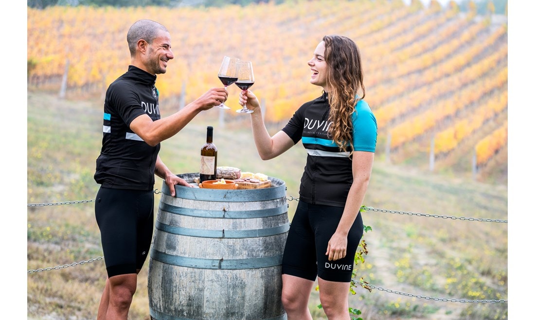 Cycling enthusiasts enjoying wine in France